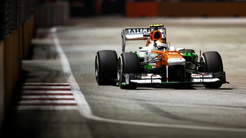 Formula One Car on Track — Orange, Dynamic, Night, Photograph