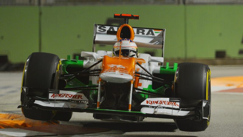 Formula One Car on Track — Orange, Dynamic, Night
