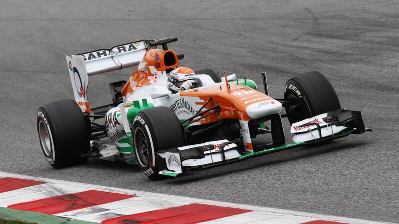 Formula One Car on Track — Orange, Dynamic, Photograph, Driver, Racing Tire