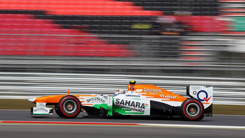 Formula One Car on Track — Orange, Dynamic, Photograph, Race Car, Grandstand