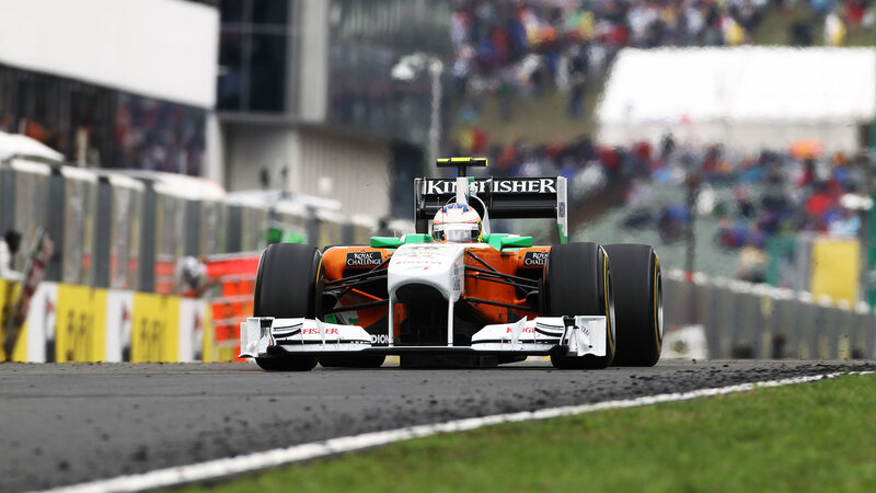 Formula One Car on Track — Orange, Dynamic, Photograph
