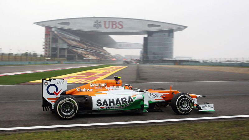 Formula One Car on Track — Orange, Overcast