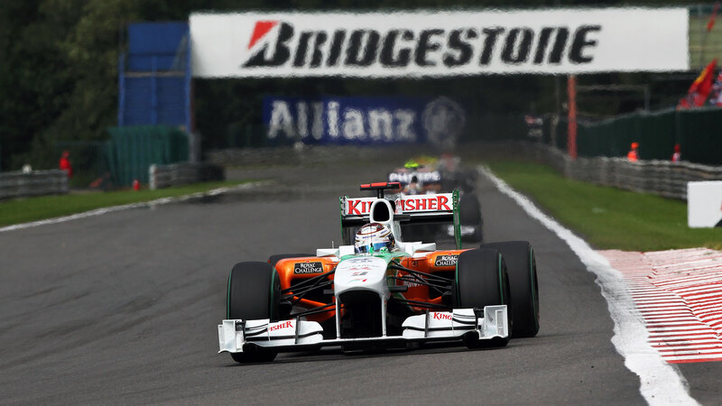 Formula One Car on Track — Orange
