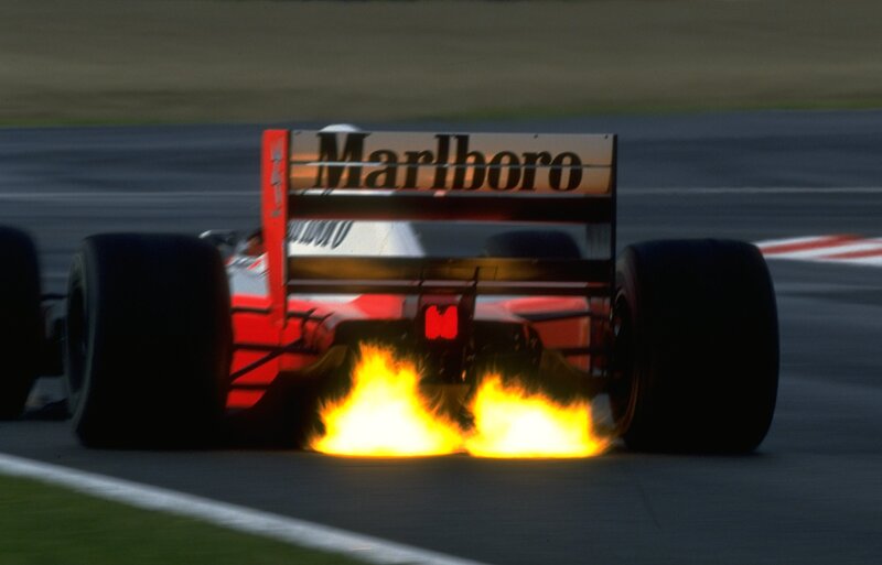 Formula One Car on Track — Red, Dramatic