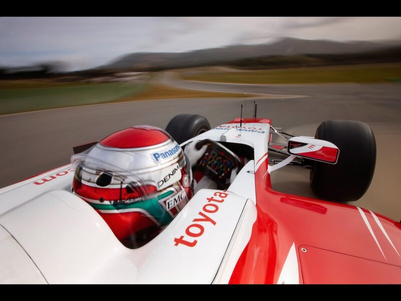 Formula One Car on Track — Red, Dynamic, Afternoon, Photograph, Driver, Helmet