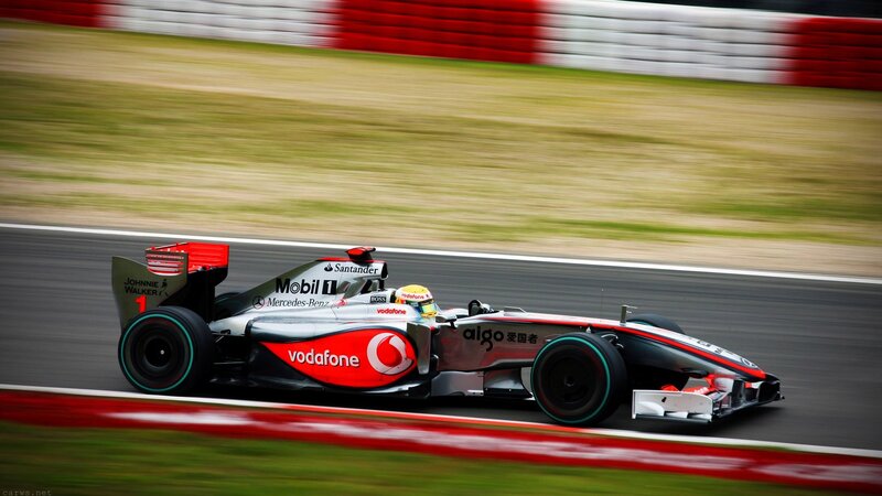Formula One Car on Track — Red, Dynamic, Afternoon, Photograph, Driver, Racing Circuit, Grass