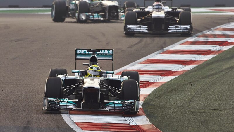 Formula One Car on Track — Silver, Competitive, Afternoon