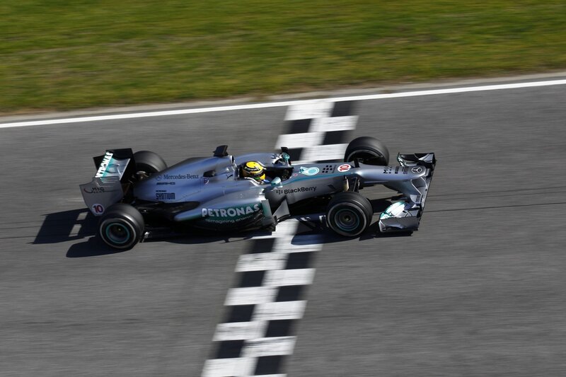 Formula One Car on Track — Silver, Dynamic, Afternoon, Photograph, Driver, Checkered Flag