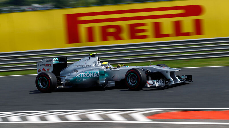 Formula One Car on Track — Silver, Dynamic, Afternoon, Photograph, Driver, Guardrail