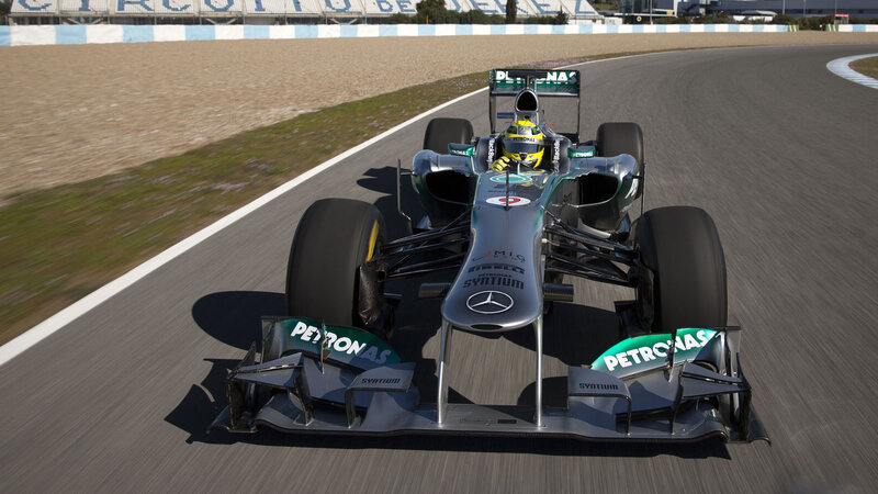 Formula One Car on Track — Silver, Dynamic, Afternoon, Photograph, Driver, Race Track, Tire