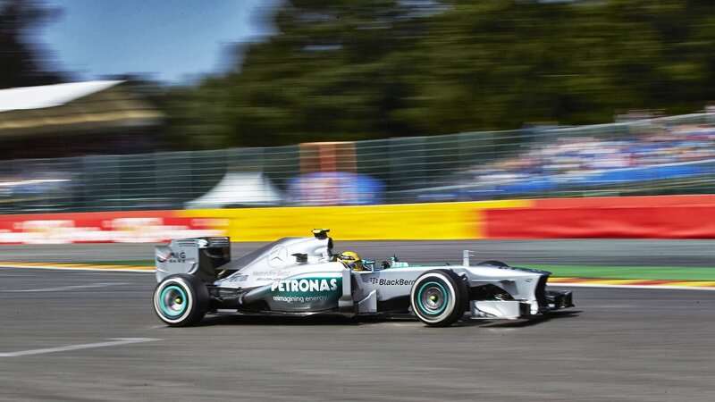 Formula One Car on Track — Silver, Dynamic, Afternoon, Photograph, Driver, Racetrack, Fence