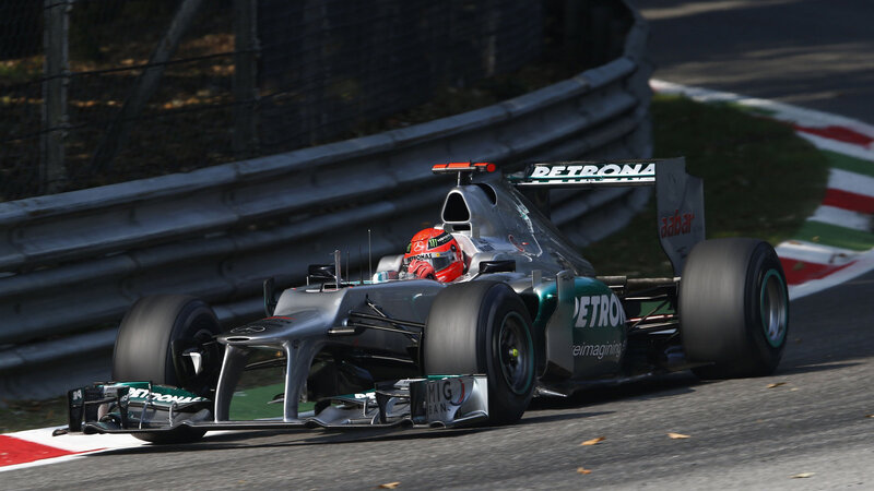 Formula One Car on Track — Silver, Dynamic, Afternoon, Photograph, Driver, Racing Car, Track Barrier