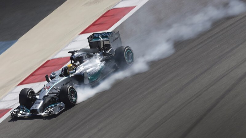 Formula One Car on Track — Silver, Dynamic, Afternoon, Photograph, Driver, Smoke