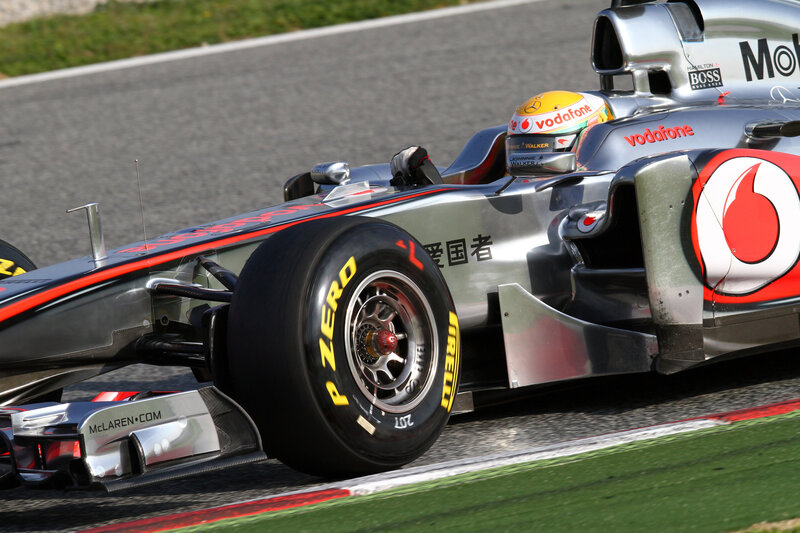 Formula One Car on Track — Silver, Dynamic, Afternoon, Photograph, Driver, Tire