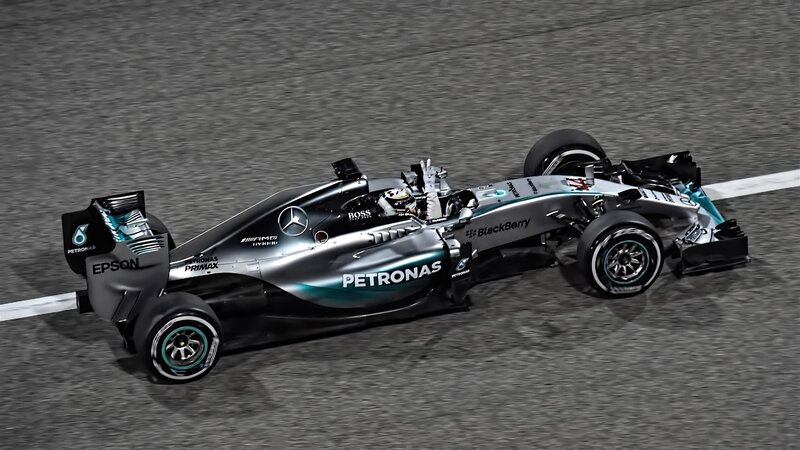 Formula One Car on Track — Silver, Dynamic, Night, Photograph, Driver, Racing Car