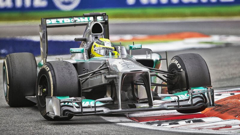 Formula One Car on Track — Silver, Dynamic, Photograph, Driver, Racing Tire