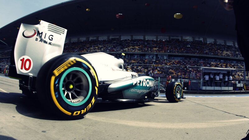 Formula One Car on Track — White, Dynamic, Afternoon, Photograph, Crowd, Pit Crew