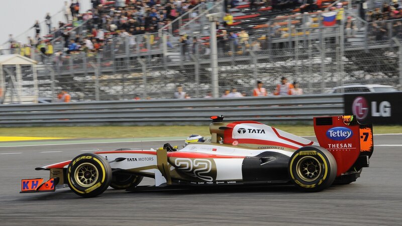 Formula One Car on Track — White, Dynamic, Afternoon, Photograph, Crowd, Race Car, Safety Barrier