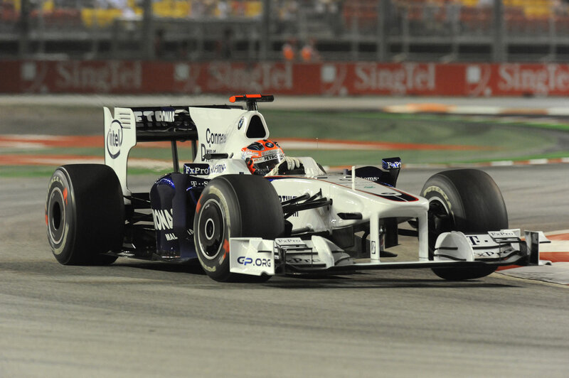 Formula One Car on Track — White, Dynamic, Night, Photograph, Driver, Race Car