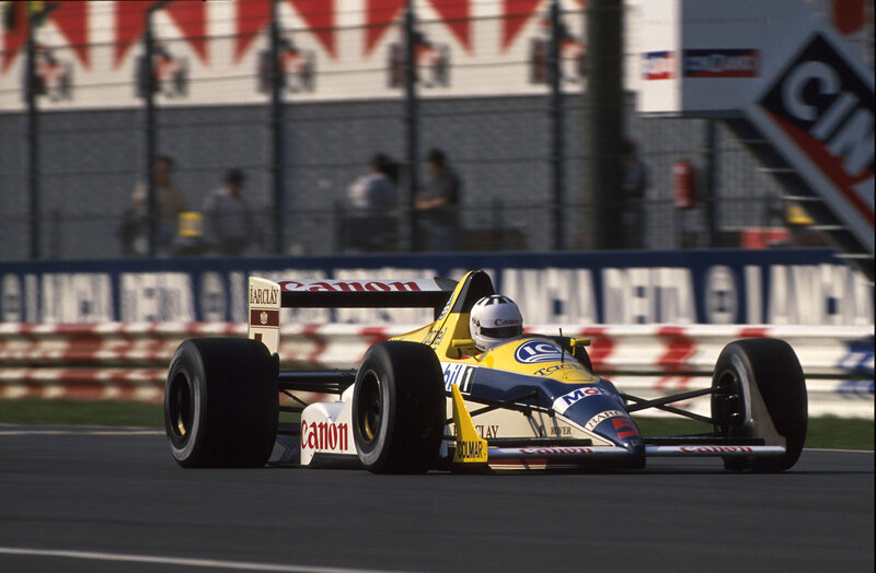 Formula One Car on Track — Yellow, Dynamic, Afternoon