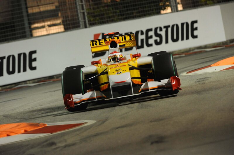 Formula One Car on Track — Yellow, Dynamic, Night