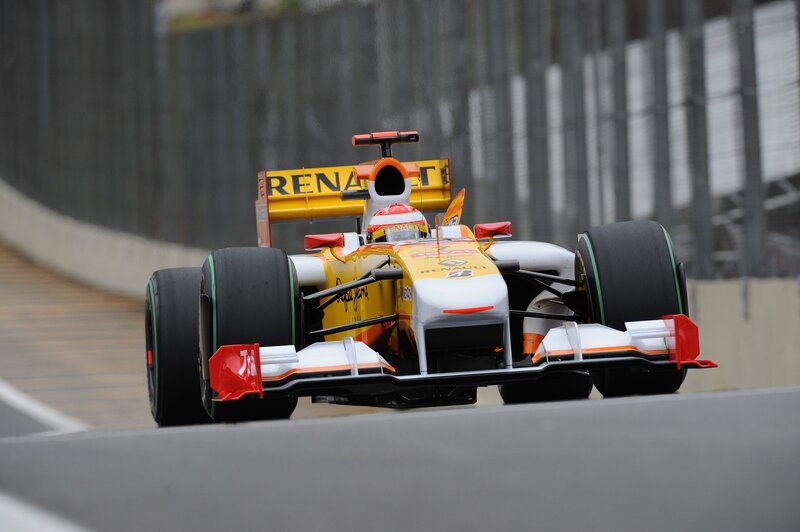 Formula One Car on Track — Yellow, Dynamic, Photograph