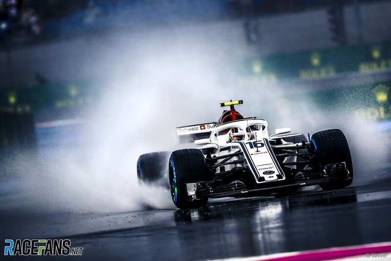 Formula One Car on Wet Track — White