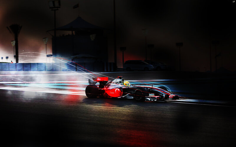 Formula One car racing at night