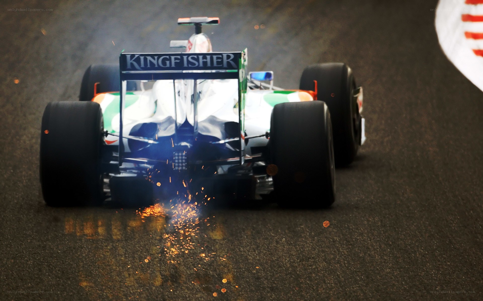 Formula One car sparks on track