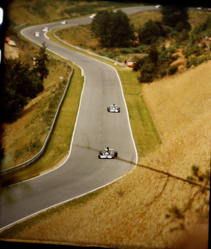 Formula One cars on a winding track