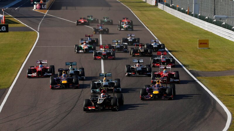 Formula One Cars on Track — Black, Dynamic, Afternoon, Photograph, Race Cars, Grass, Safety Barrier
