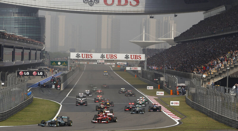 Formula One Cars on Track — Gray, Competitive, Afternoon, Photograph, Crowd