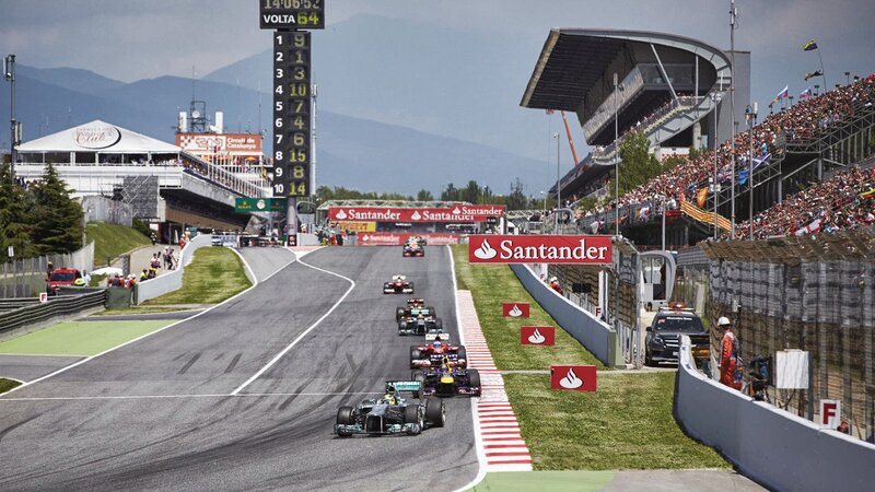 Formula One Cars on Track — Gray, Competitive, Afternoon, Photograph, Race Cars, Grandstands