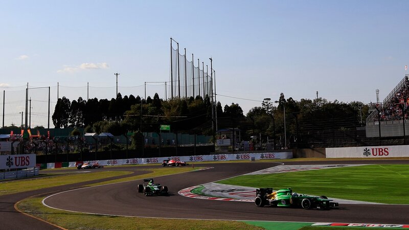 Formula One Cars on Track — Green, Competitive, Afternoon, Photograph