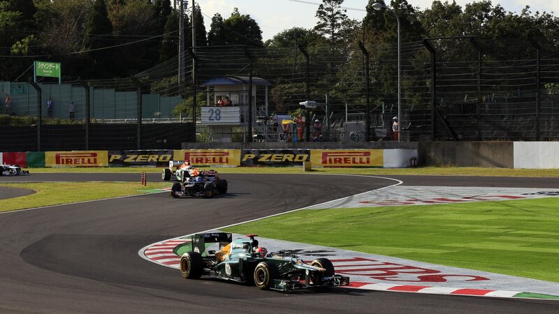 Formula One Cars on Track — Green, Dynamic, Afternoon