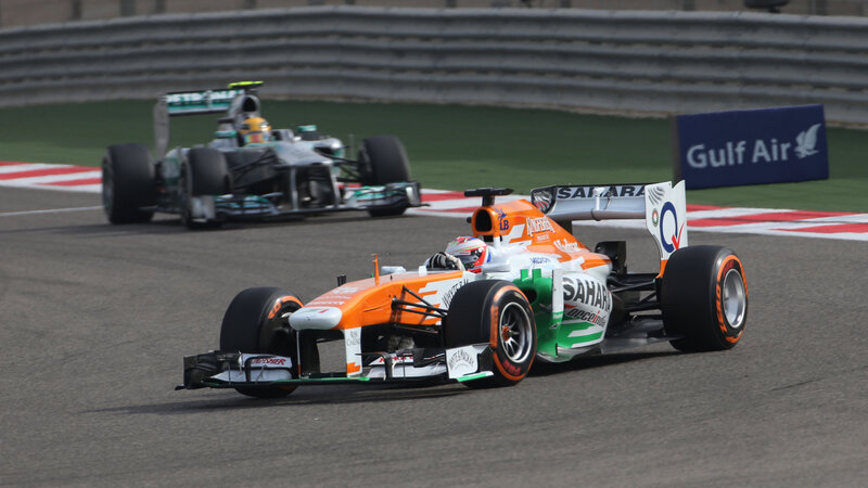 Formula One Cars on Track — Orange, Dynamic, Afternoon