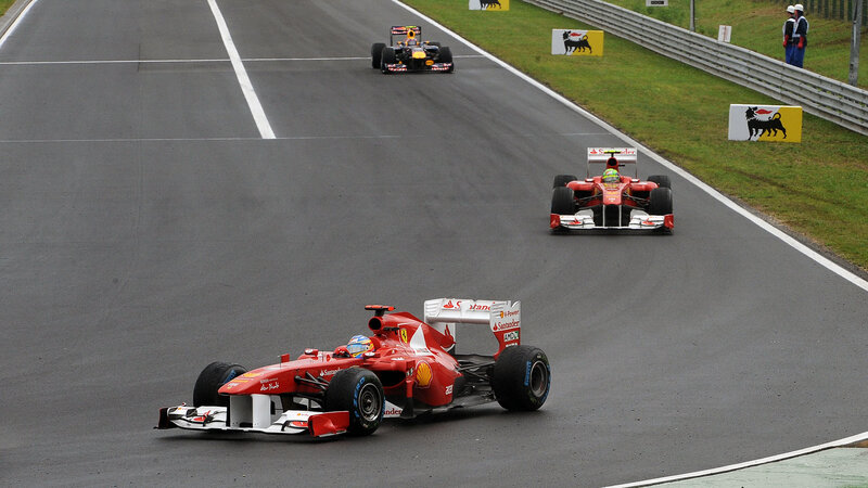 Formula One Cars on Track — Red, Competitive, Afternoon