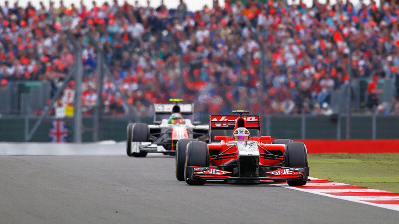 Formula One Cars on Track — Red, Competitive