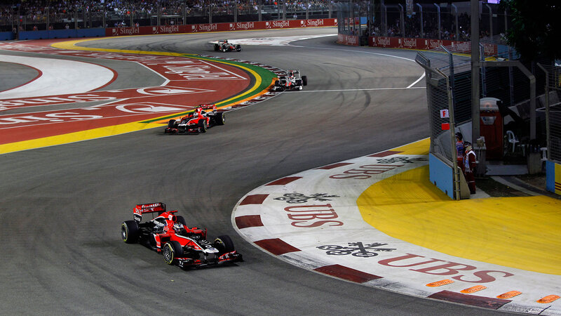 Formula One Cars on Track — Red, Dynamic, Night