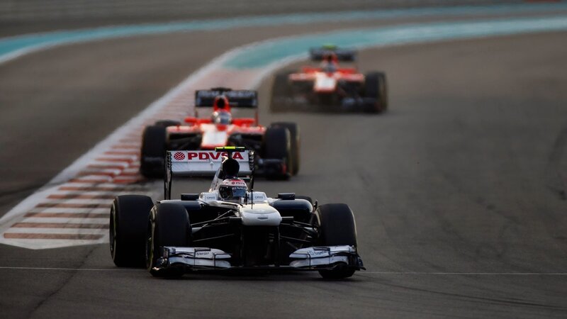 Formula One Cars on Track — White, Dynamic, Night