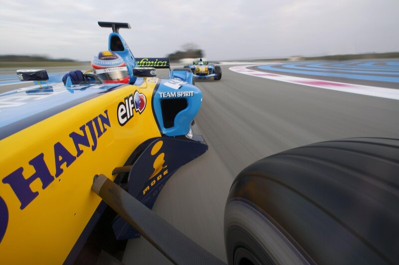 Formula One Cars on Track — Yellow