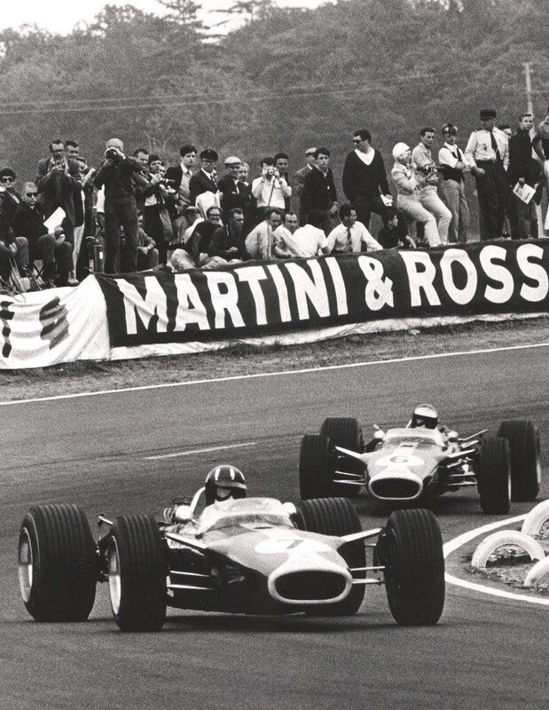 Formula One Cars Racing — Black, Dynamic, Afternoon, Photograph, Crowd, Banners