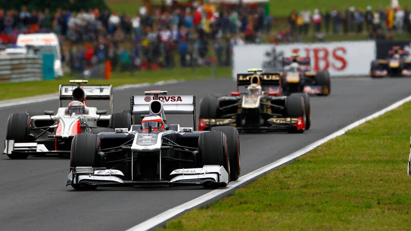Formula One Cars Racing — Black, Dynamic, Afternoon, Photograph, Crowd, Track, Grass