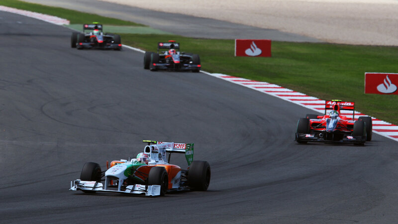 Formula One Cars Racing — Black, Dynamic, Afternoon, Photograph, Race Track, Grass