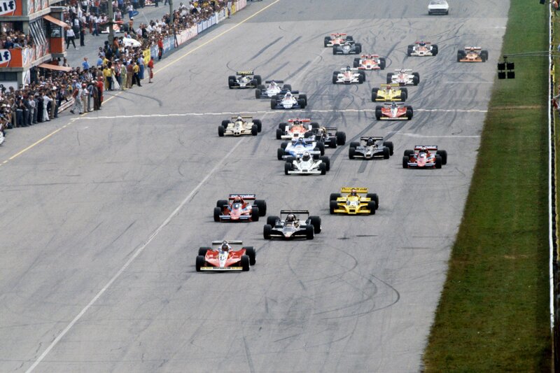 Formula One Cars Racing — Gray, Dynamic, Afternoon, Photograph, Crowd, Racetrack, Grass