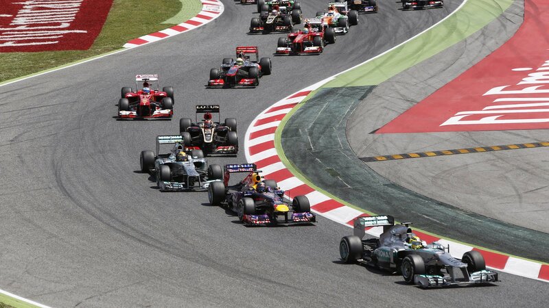 Formula One Cars Racing — Gray, Dynamic, Afternoon, Photograph, Race Track, Driver, Curved Turn