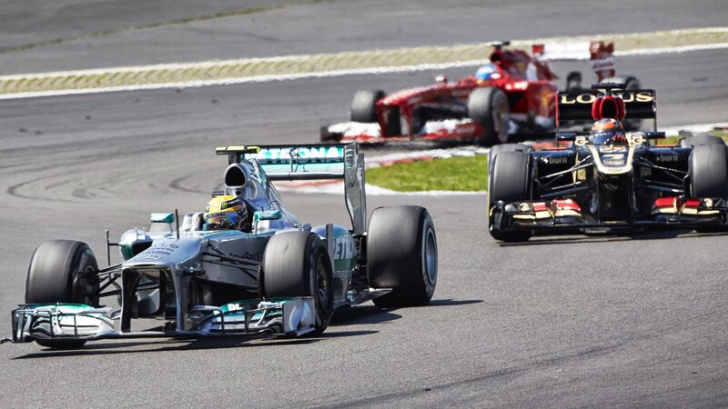 Formula One Cars Racing — Gray, Dynamic, Afternoon, Photograph, Race Track, Driver, Grass