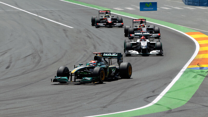 Formula One Cars Racing — Gray, Dynamic, Afternoon, Photograph, Racetrack