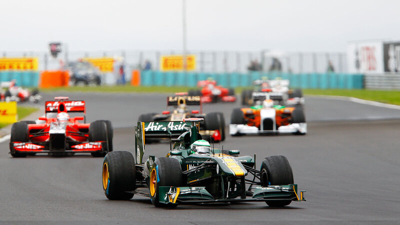 Formula One Cars Racing — Green, Competitive, Afternoon