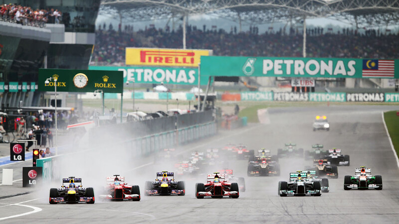 Formula One Cars Racing — Green, Dynamic, Afternoon, Photograph, Crowd